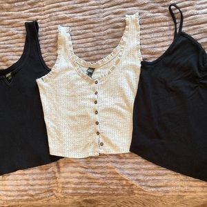 Lot of three crop tanks. One grey, two black.